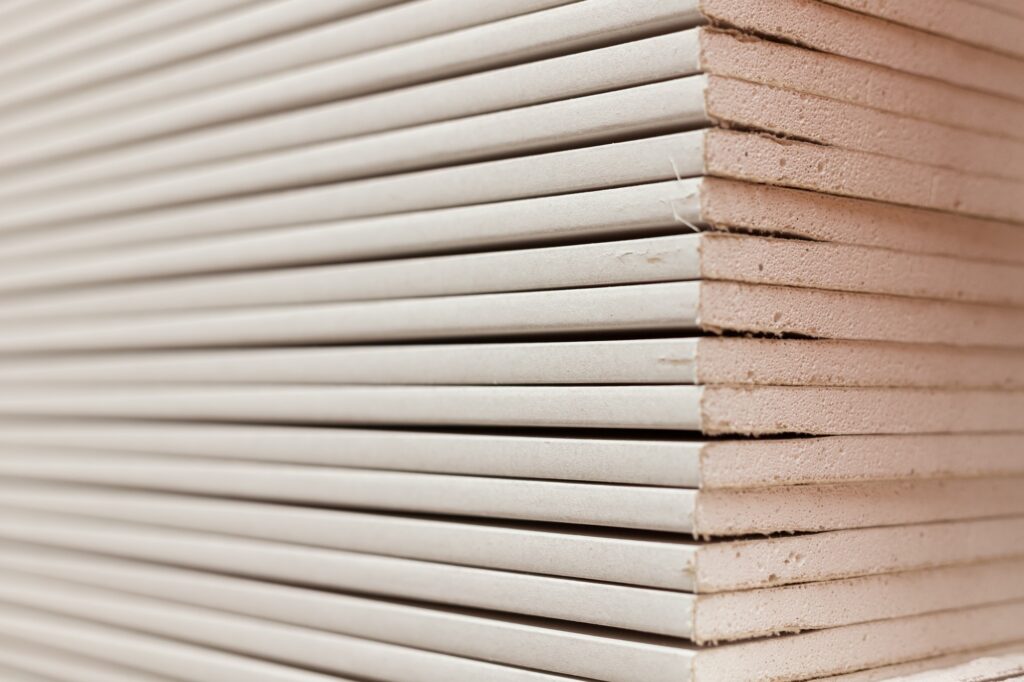 Stack of gypsum boards. Drywall packs. Close-up